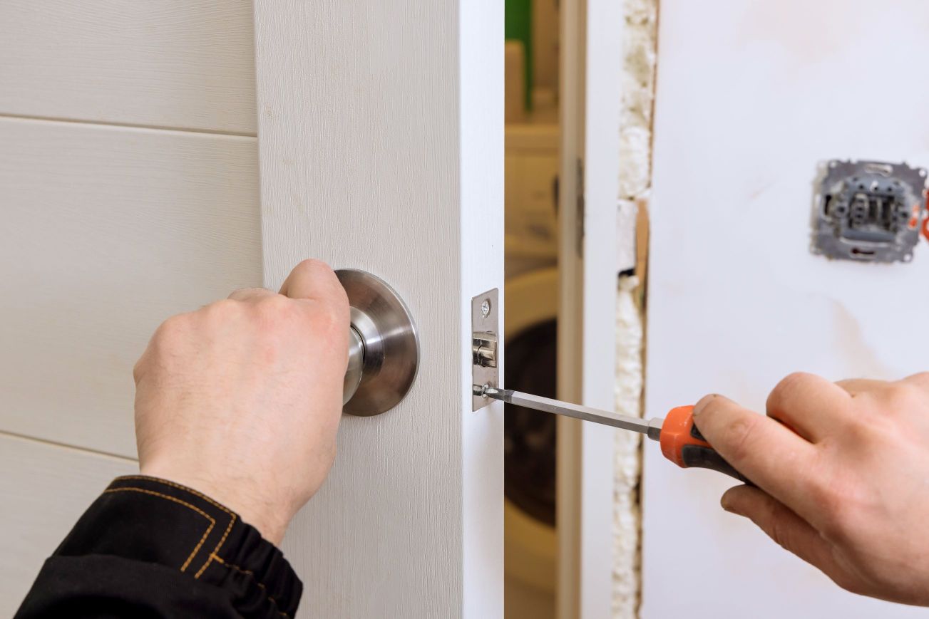 Locksmith reparing a lock